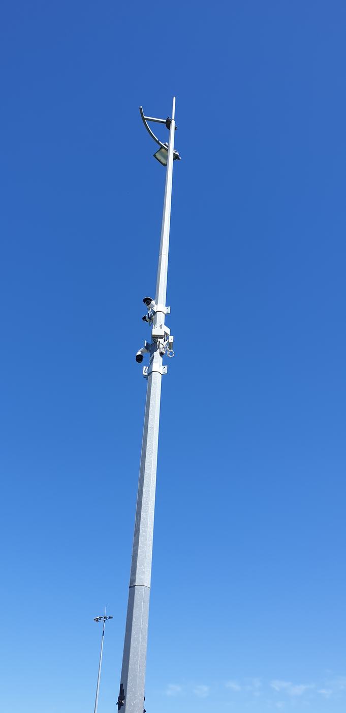 Multi-head CCTV camera pole covering a commercial car park Multi-head CCTV camera pole covering a commercial car park