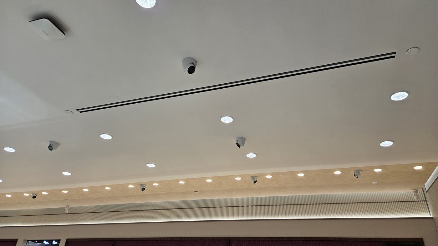 Ceiling mounted security camera inspected during an audit Ceiling mounted security camera inspected during an audit