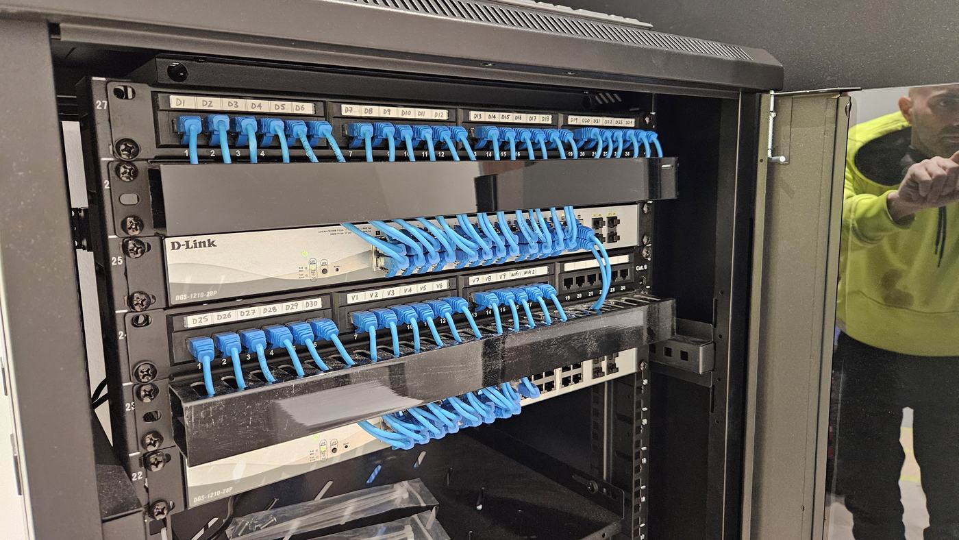 Network switch and patch panel in a comms rack Network switch and patch panel in a comms rack