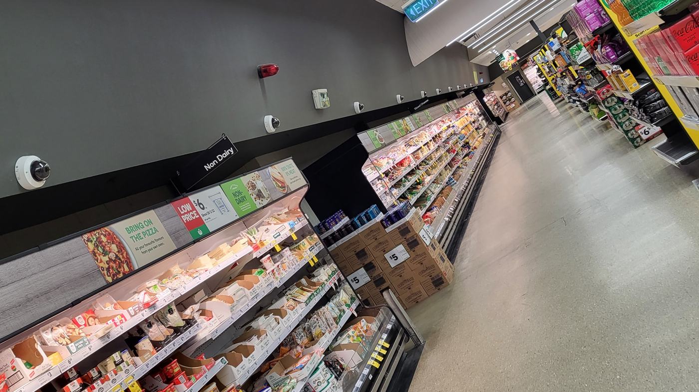 Retail CCTV camera covering a shop aisle