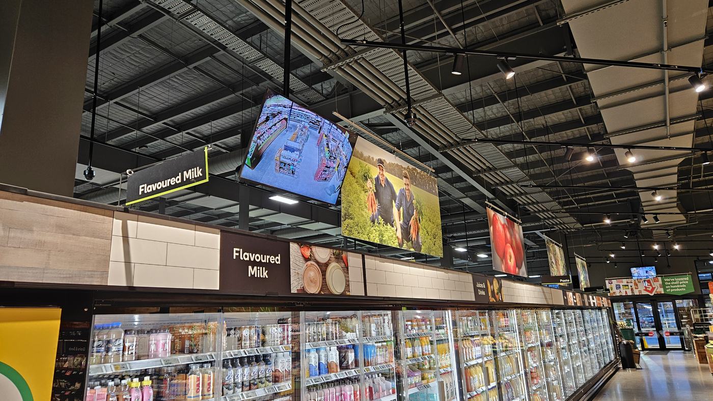 Supermarket aisle with CCTV monitor display installed by Nootz